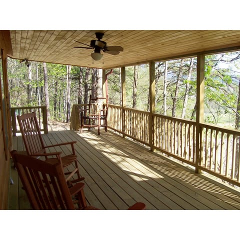 Covered porch overlooking the valley below.