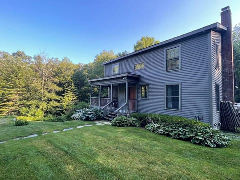 The house is a custom timber frame with distinct and timeless styling that blends into the surrounding area.