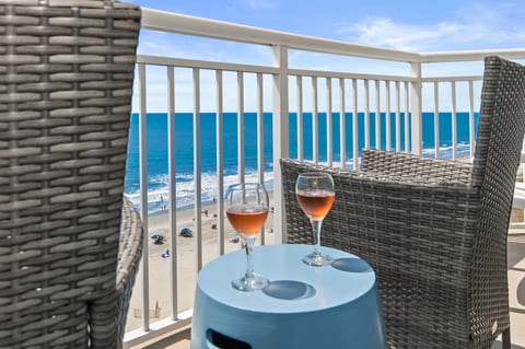 Oceanfront balcony with coastal views—sip and unwind above the beach.