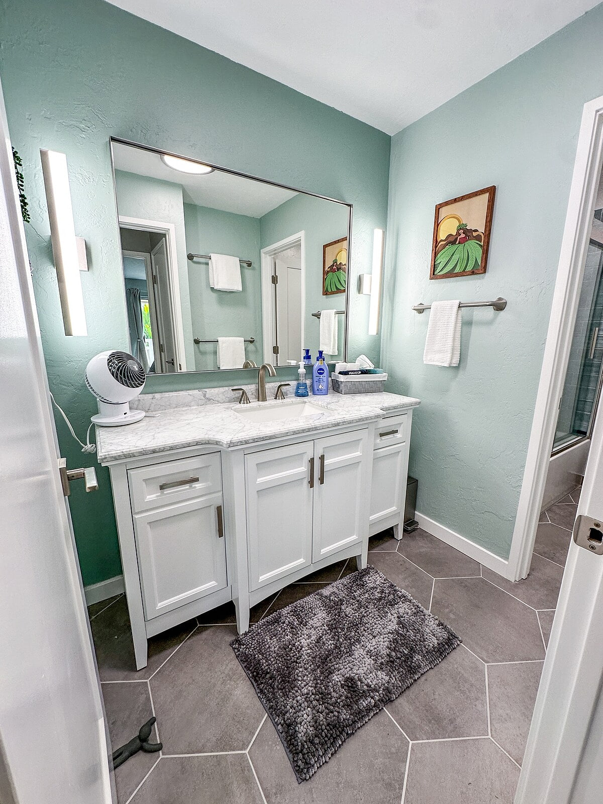 Separate powder room from main bathroom with ample light and fan. Newly renovated Coconut Coast 1BR condo w/ A/C