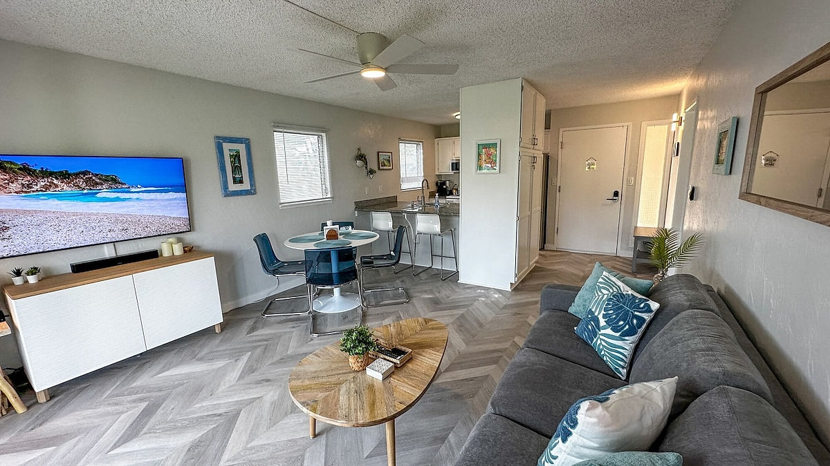Living area Fully Renovated 1BR/1BA condo w/AC. Short walk to beach & Coconut Marketplace!