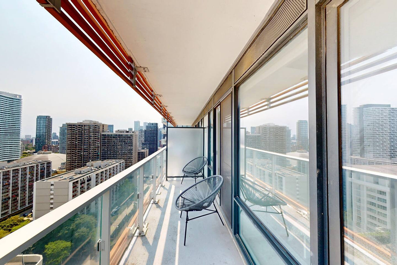 Full-length balcony that stretches along the suite with sliding-door access.