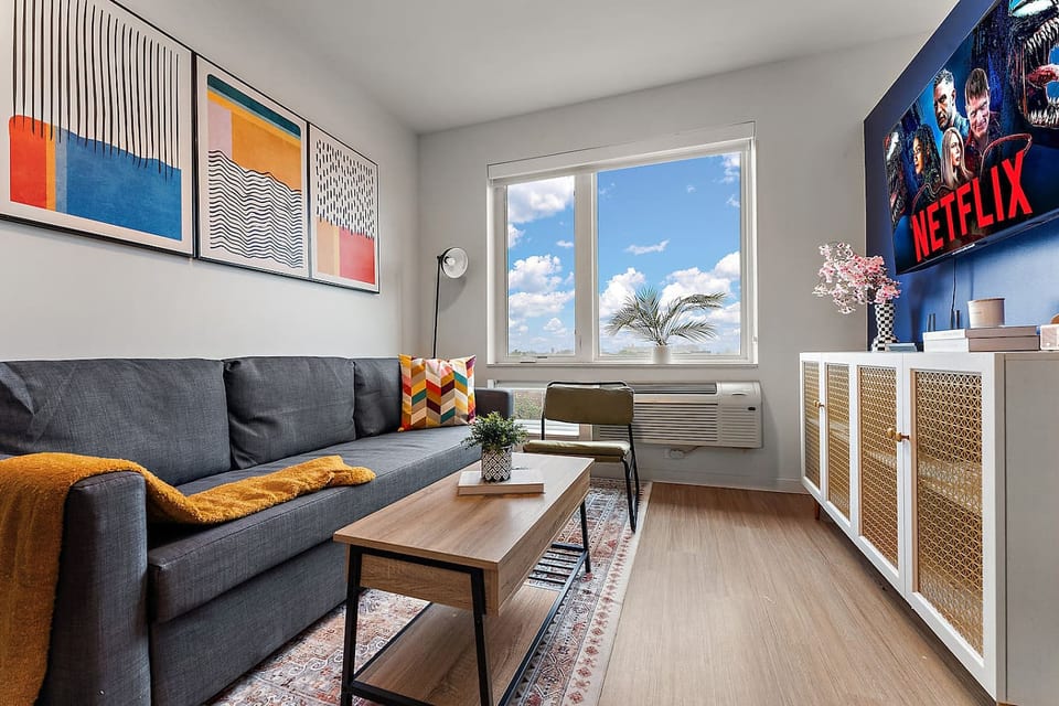 Living Room: Bright space with stunning views, perfect for movie nights and relaxation!