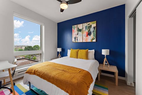 Bright walls and vibrant decor create an inspiring urban escape with stunning views!