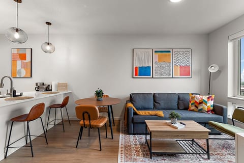 Living Room: Brighten your stay with vibrant art and stylish seating—perfect for relaxation and fun!