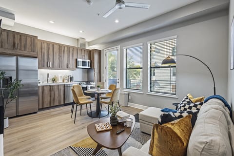 Stylish and spacious living area with a modern kitchen.