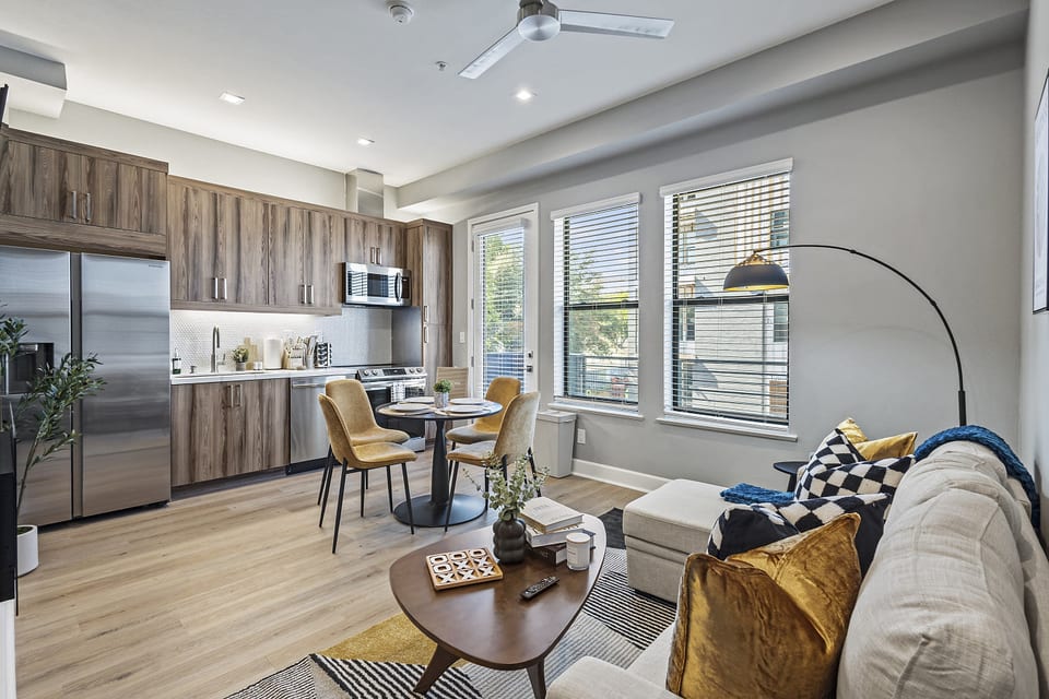 Stylish and spacious living area with a modern kitchen.