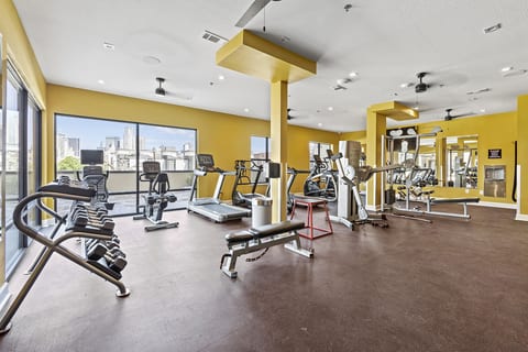 State-of-the-art gym with cardio equipment, weights, and stunning views of the city.