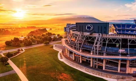 Golden sunset views beside an iconic stadium and expansive green space