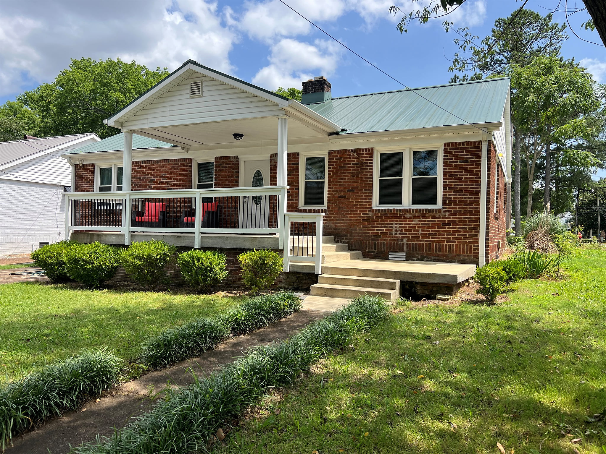 Front of house from the street sidewalk.