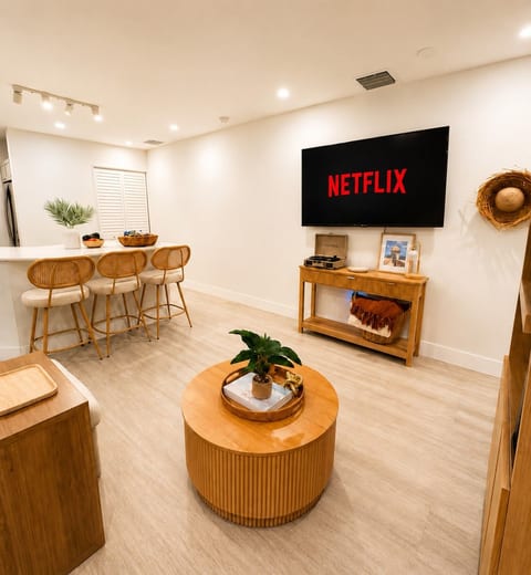 Unwind with your favorite shows in our comfortable living room featuring a Smart TV.