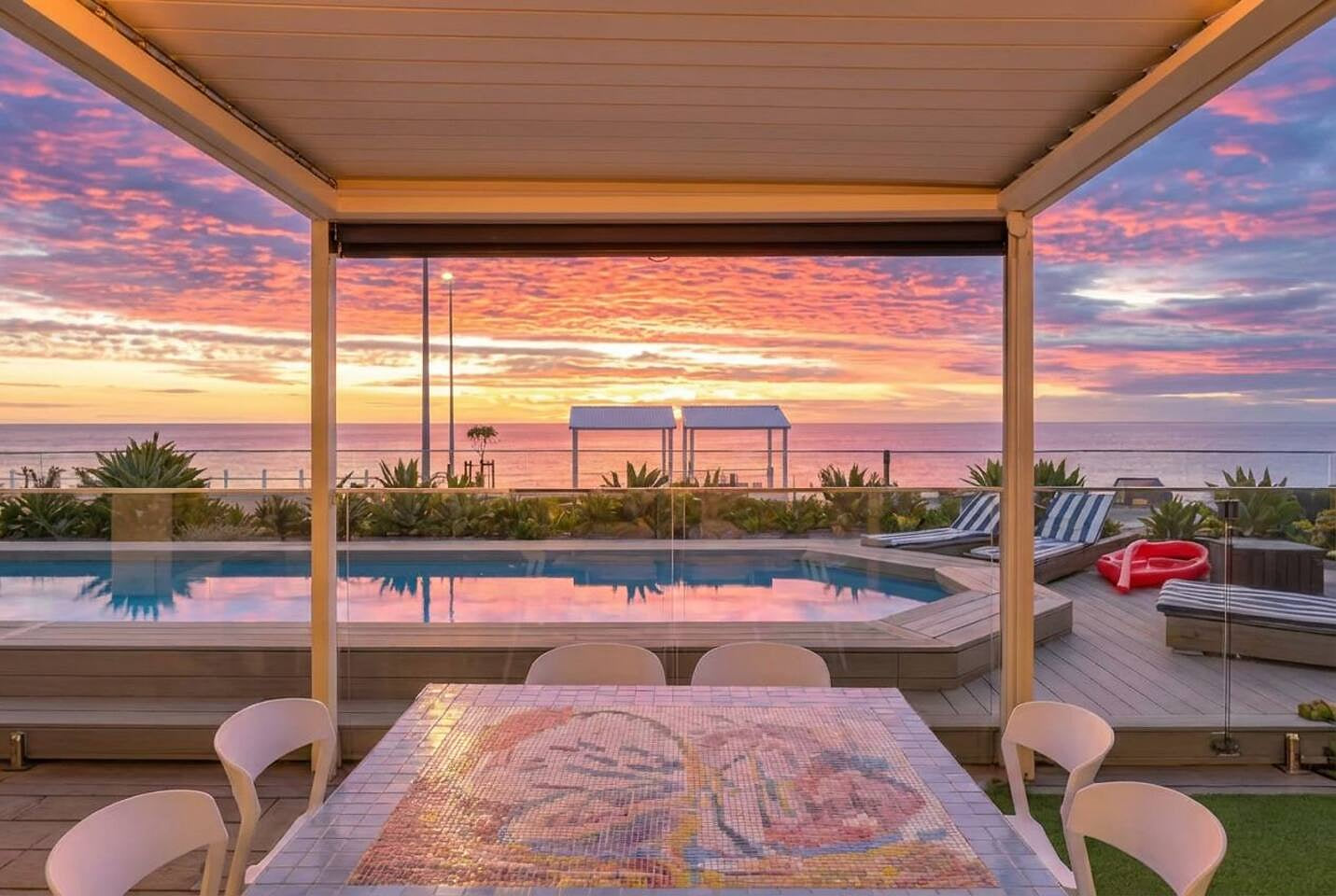 THE SUNSET POOL HOUSE - Dine or unwind under the shade of our poolside pergola, where mosaic tables, comfy chairs and endless ocean vistas create effortless holiday magic.