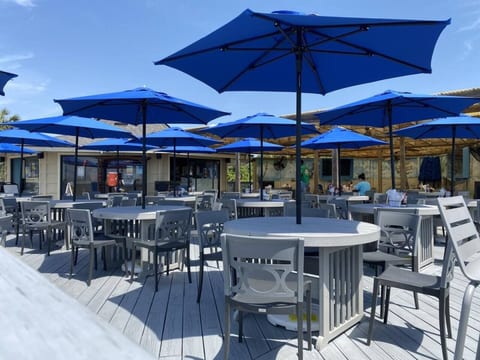 Fun Beachfront Tiki Bar & Grille w/ tons of Oceanfront outdoor seating!  Has a great food, cocktail & beer menu - order to go and enjoy poolside!!