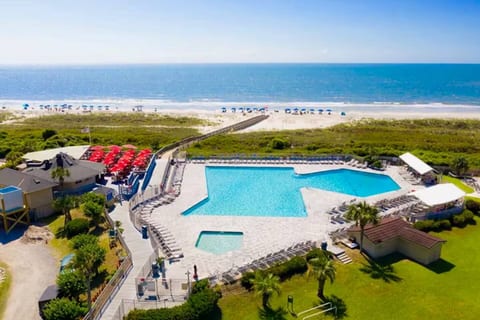 Largest oceanfront pool on Hilton Head Island! Tiki Beachfront Bar located to the right serves drinks and food!