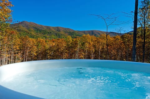 Unwind in the hot tub while soaking in breathtaking mountain views and complete tranquility.