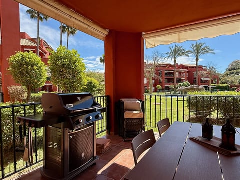 Pool view private terrace ground floor Mijas Costa with barbecue by Solrentspain
