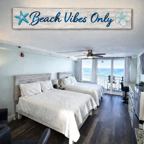 Oceanfront studio with 2 queens, balcony + sweeping sea views