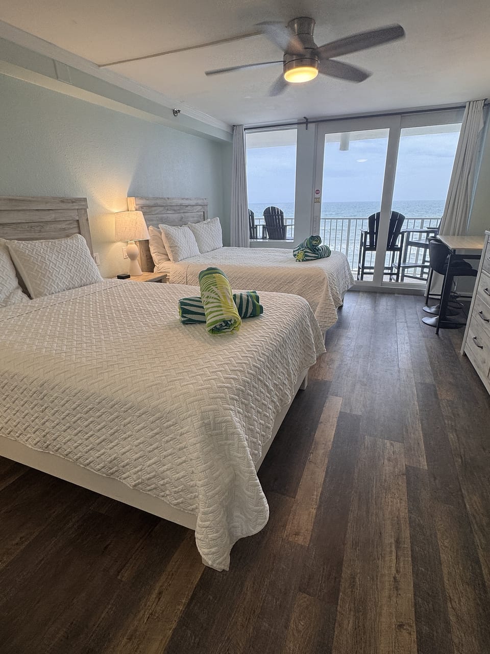 Two queen beds with private balcony and stunning oceanfront views
