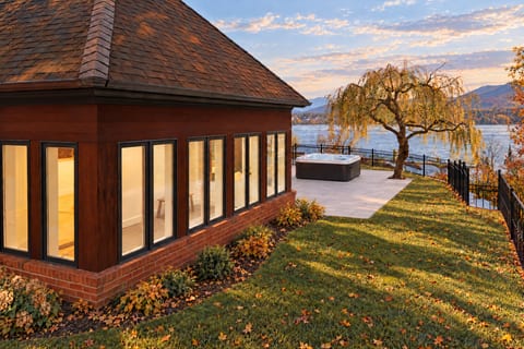 Sunroom exterior w/ hot tub in background