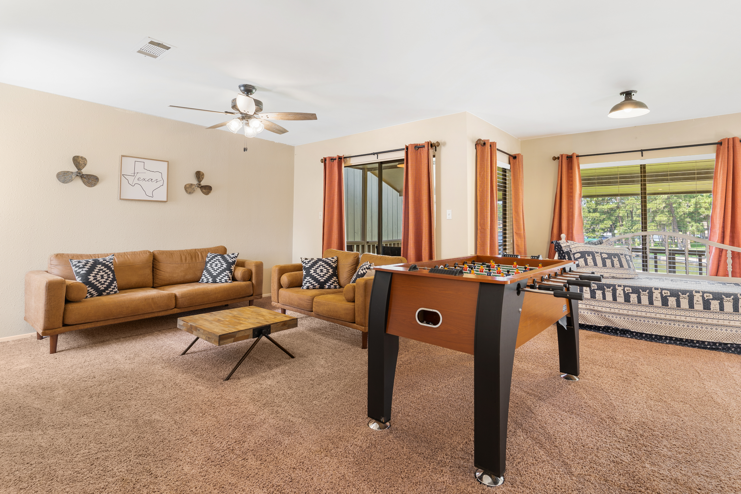 Upstairs loft with a day bed/trundle. Sleeps 2. Doors to the balcony