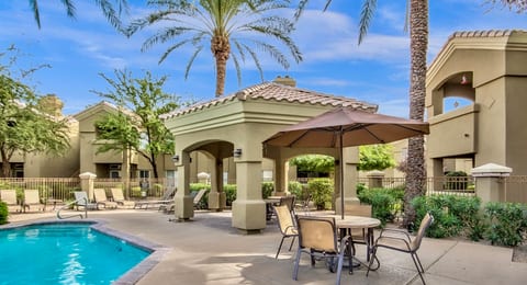 2 large BBQs and eating area by the pool side