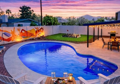 Private heated pool, giant chess & backyard oasis at sunset