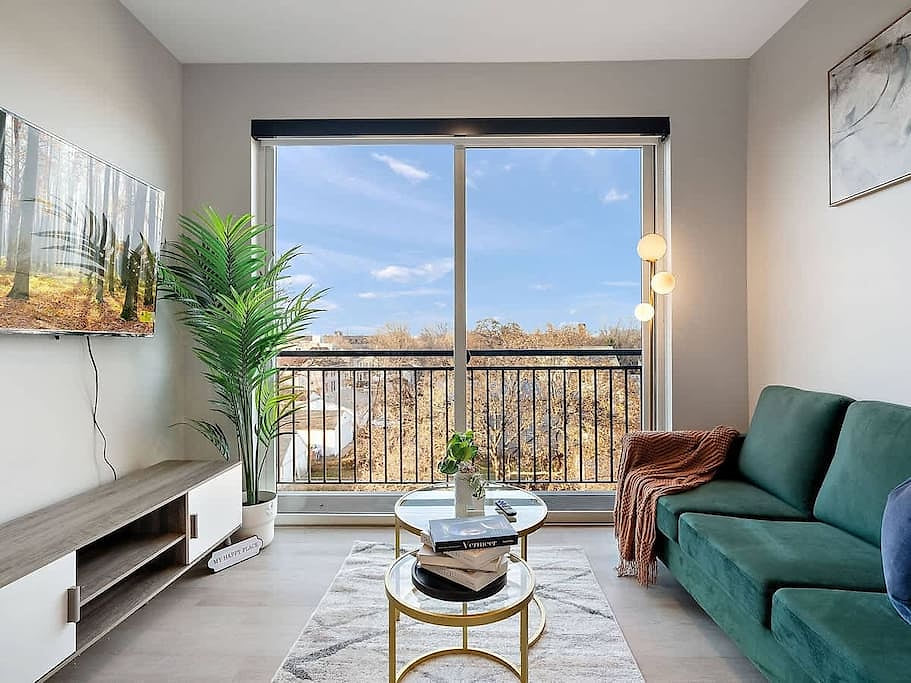 Modern oasis with stunning views, cozy velvet sofa, and chic decor. Relax & unwind!