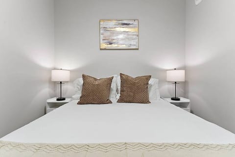 Queen Bed with bedside lamps