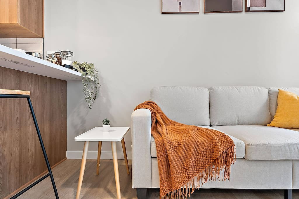 Minimalist charm with cozy accents—perfect for relaxing in style and comfort.