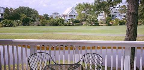 Balcony over looking small pond/marsh and golf course. Small table and chairs (seating for 4)