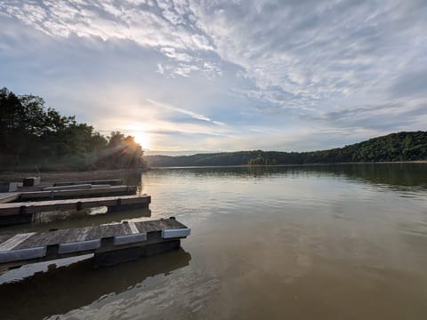 Peaceful lakefront docks with serene water and stunning sunset views