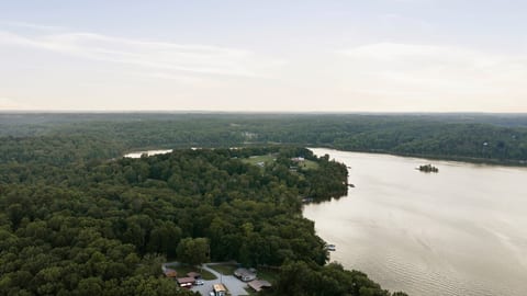Serene lakefront retreat with sweeping water views and wooded privacy