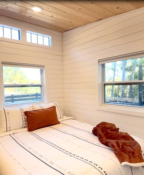 Sink into a plush queen bed after a long soak — quiet nights on the ridge