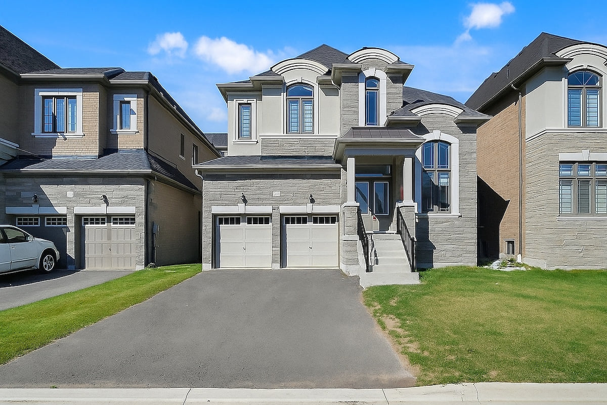 Welcome to this beautiful and spacious detached home, featuring a classic stone and brick exterior and a two-car garage. 