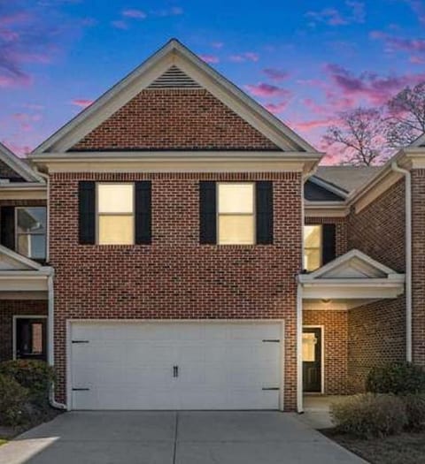 Welcome to this beautiful two-story brick townhouse featuring a modern design and inviting curb appeal. With a spacious two-car garage, well-lit entryway, and EV Ready, it offers the perfect blend of comfort and convenience for your stay.