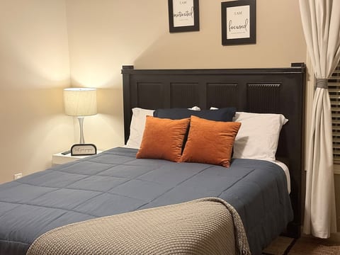 Relax and unwind in this beautifully styled bedroom designed for both comfort and productivity.