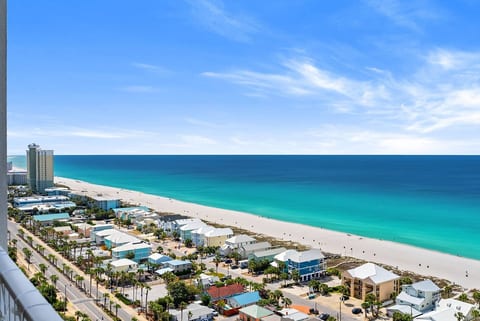 Breathtaking panoramic views of the emerald water and sugar-white sand coastline.