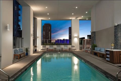 Stylish Retreat with Pool, Gym, Lounge and Private Balcony