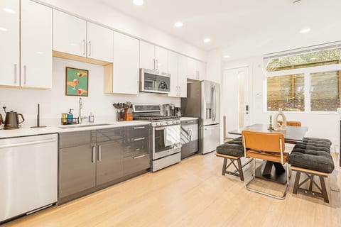 Kitchen with cookware, dishes and plates, and basic cooking seasonings