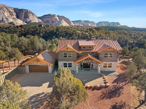 Front of the home with cliff view