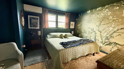 The king bedroom features its own heating/cooling unit and that gorgeous Almond Blossoms-inspired mural wall.