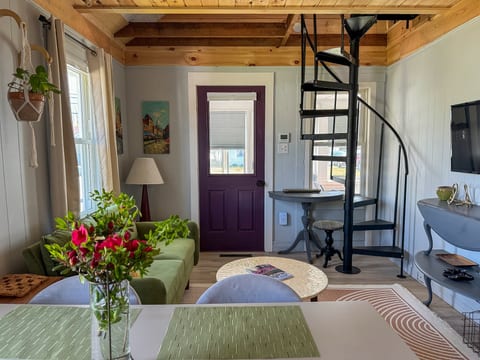 The main room is an open concept living/dining/kitchen space