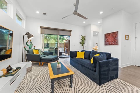 [Living area] 65" smart TV & sliding doors to the backyard