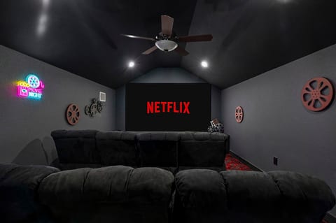 Sink into cozy seating, dim the lights, and let the big screen transport you to another world.
