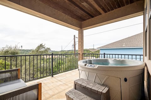 Step into your private hot tub and let the warm, bubbling water melt your stress away.