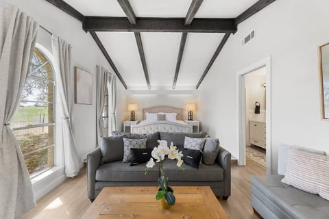 Stylish living area with beams and cozy seating