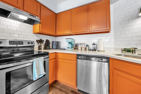 Kitchen with range, dishwasher, coffee maker and air fryer. Morning coffee can be brewing before anyone's out of bed.