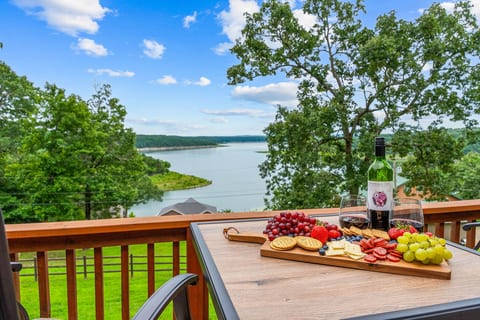 Pour a glass, build the board, and pull your chair out to the upper deck — the lake fills the horizon from every seat at this table. Bull Shoals is right there, every meal.