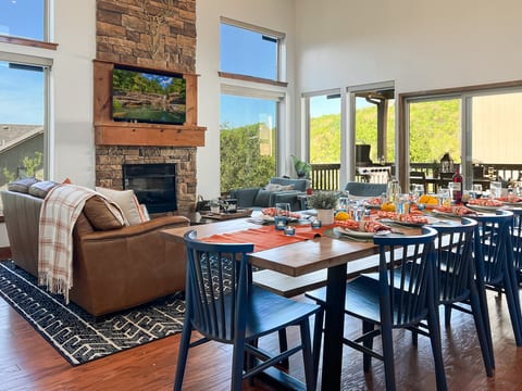 Gather in the vaulted living room where natural light and mountain views fill every corner