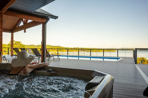 Sink into the warm bubbles of the hot tub while taking in panoramic lake views—the ultimate way to unwind after a day of adventure.